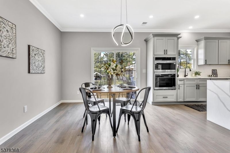 Dining room, Interior, Kitchen, Pendant Lights, Recessed Lighting, Stainless Steel Appliances, Wood Texture Flooring