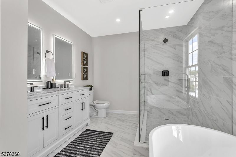 Bathroom, Dual Sink Vanities, Glass Shower, Interior, Marble, Marble Walls, Recessed Lighting