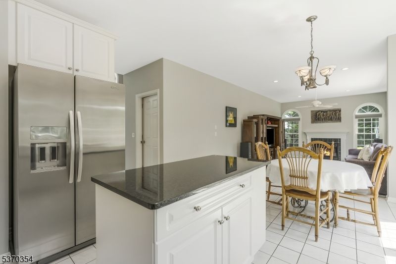 Chandelier, Dining room, Fireplace, Interior, Kitchen, Pendant Lights, Recessed Lighting, Stainless Steel Appliances