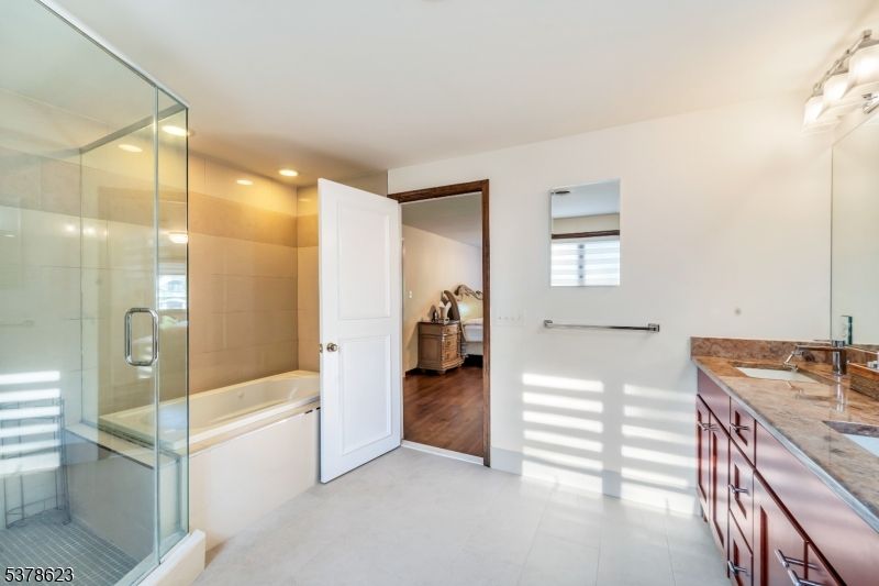 Bathroom, Dual Sink Vanities, Glass Shower, Interior, Recessed Lighting, Wood Texture Flooring