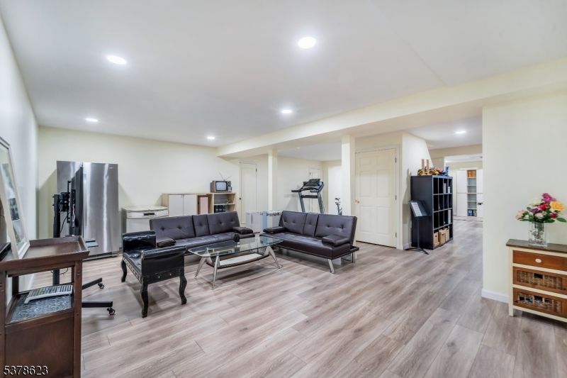 Fitness Equipment, Interior, Kitchen, Living room, Recessed Lighting, Stainless Steel Appliances, Wood Texture Flooring