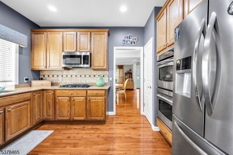 Interior, Kitchen, Recessed Lighting, Tile Countertops, Wood Texture Flooring