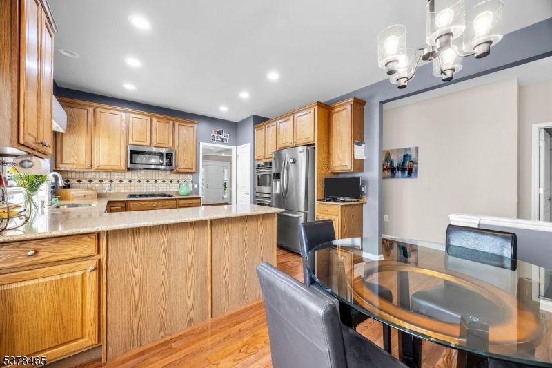 Dining room, Interior, Kitchen, Recessed Lighting, Stainless Steel Appliances, Wood Texture Flooring