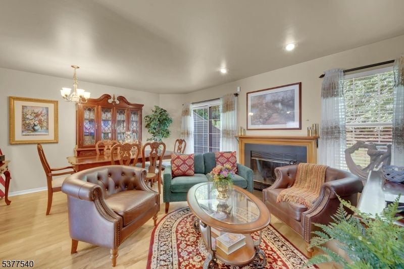 Chandelier, Dining room, Fireplace, Interior, Living room, Recessed Lighting, Wood Texture Flooring