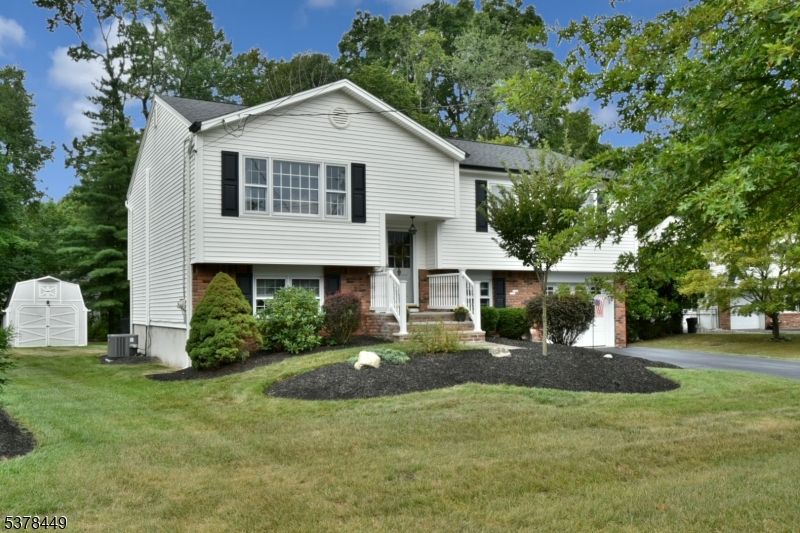 Attached, Backyard, Exterior, Facade, Brick Facade, Raised Ranch