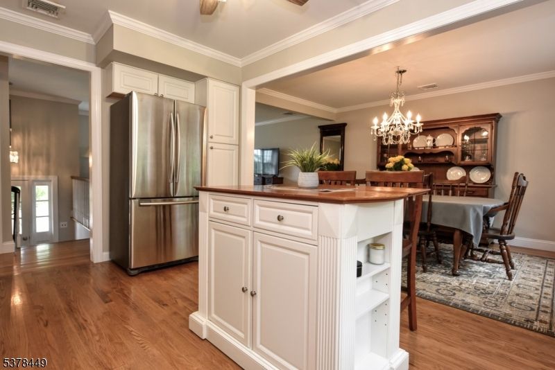 Chandelier, Dining room, Interior, Kitchen, Stainless Steel Appliances, Wood Texture Flooring