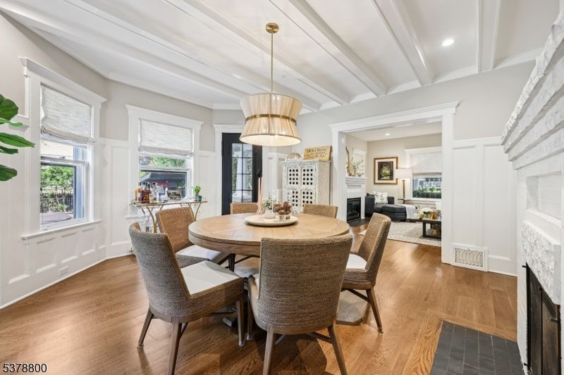 Dining room, Fireplace, Interior, Living room, Pendant Lights, Recessed Lighting, Wood Texture Flooring