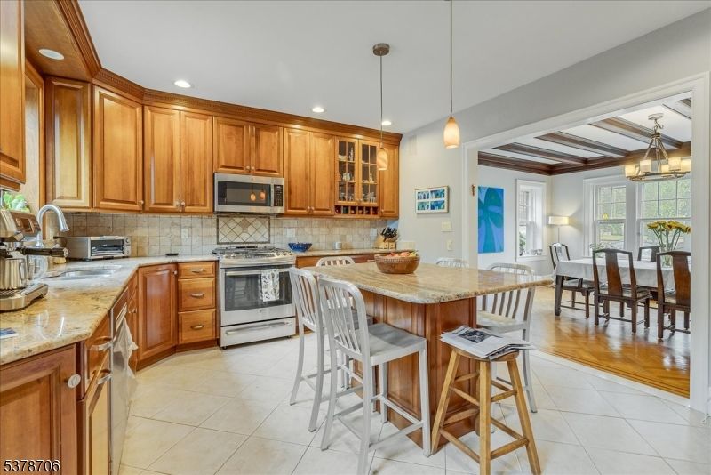 Chandelier, Dining room, Interior, Kitchen, Pendant Lights, Recessed Lighting, Stainless Steel Appliances, Wooden Beams