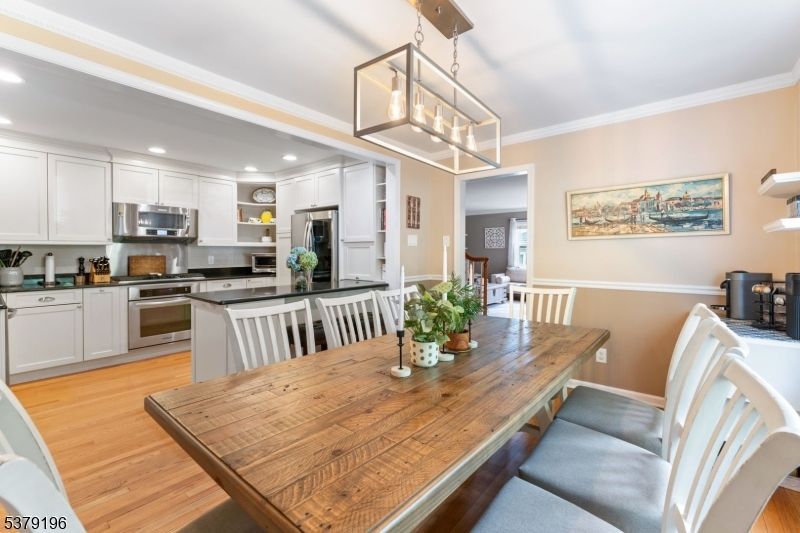 Dining room, Interior, Kitchen, Pendant Lights, Recessed Lighting, Stainless Steel Appliances, Wood Texture Flooring