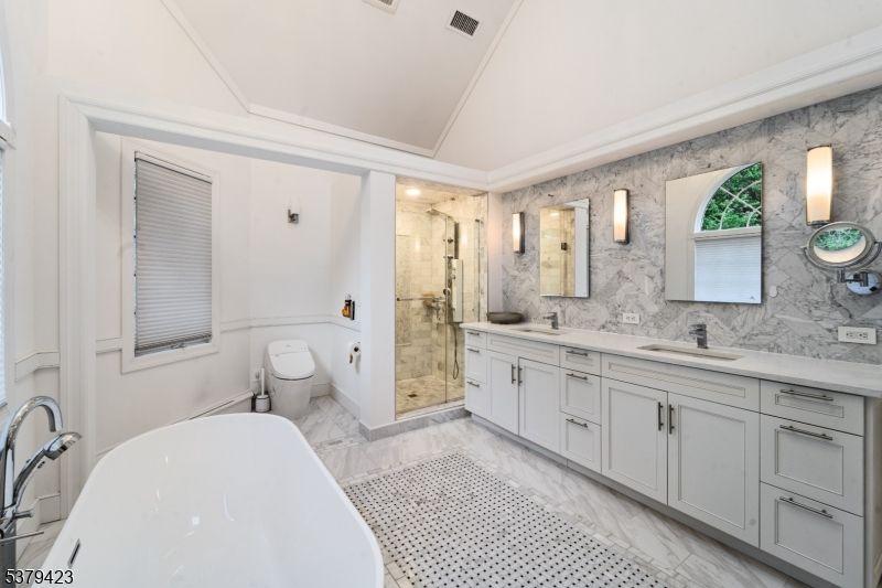 Bathroom, Dual Sink Vanities, Free Standing Baths, Glass Shower, Interior, Marble, Marble Walls, Recessed Lighting