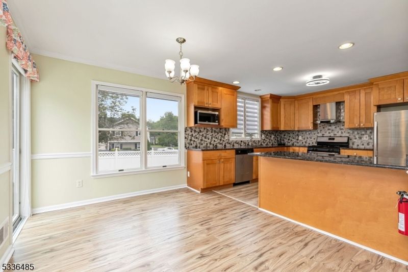 Chandelier, Interior, Kitchen, Recessed Lighting, Stainless Steel Appliances, Wood Texture Flooring