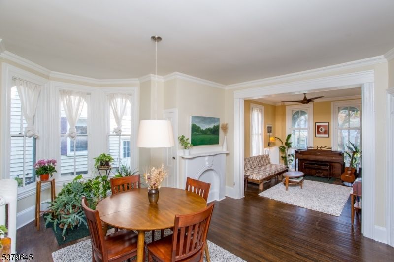 Dining room, Fireplace, Interior, Pendant Lights, Piano, Wood Texture Flooring