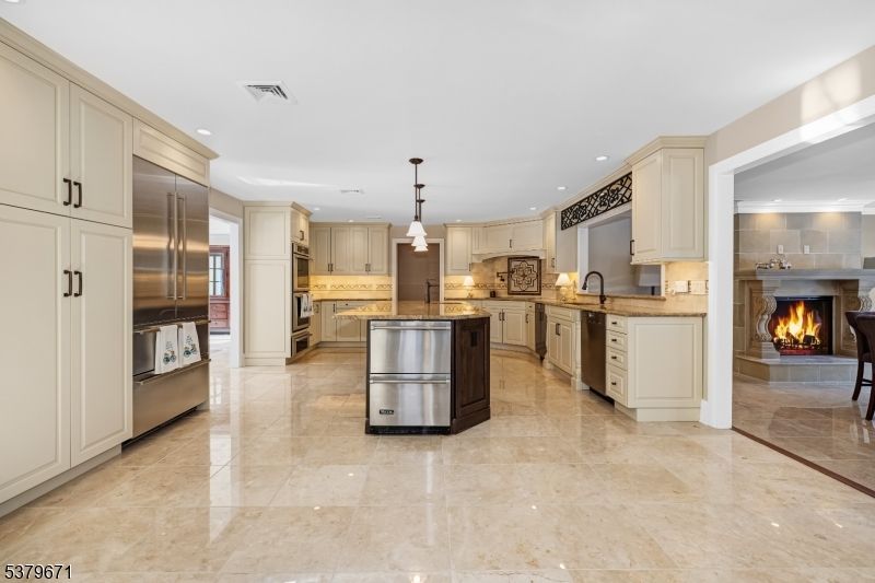 Fireplace, Interior, Kitchen, Pendant Lights, Recessed Lighting, Stainless Steel Appliances