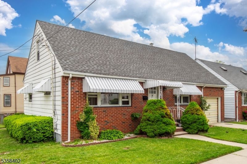 Attached, Exterior, Facade, Brick Facade, Cape Cod