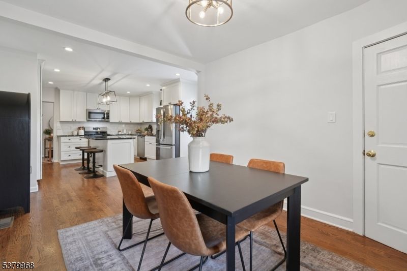 Dining room, Interior, Kitchen, Pendant Lights, Recessed Lighting, Stainless Steel Appliances, Wood Texture Flooring