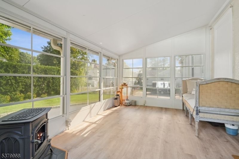 Fireplace, Interior, Sun Room, Wood Texture Flooring