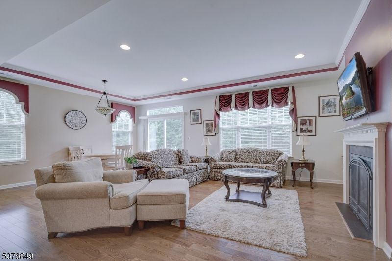 Dining room, Fireplace, Interior, Living room, Pendant Lights, Recessed Lighting, Wood Texture Flooring