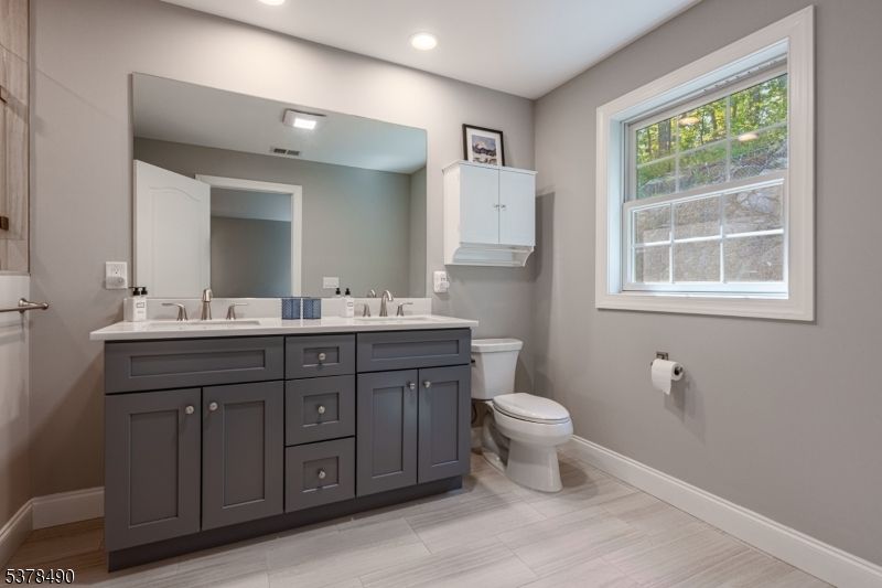 Bathroom, Dual Sink Vanities, Interior, Recessed Lighting, Wood Texture Flooring