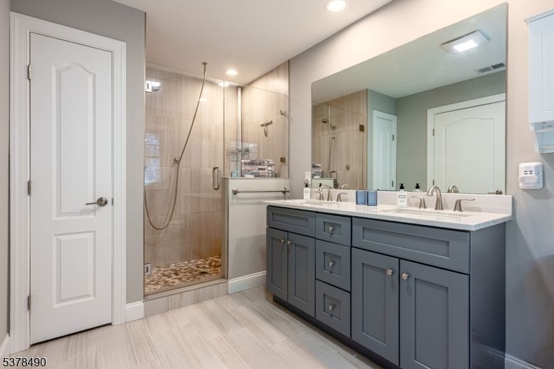 Bathroom, Dual Sink Vanities, Glass Shower, Interior, Recessed Lighting, Wood Texture Flooring