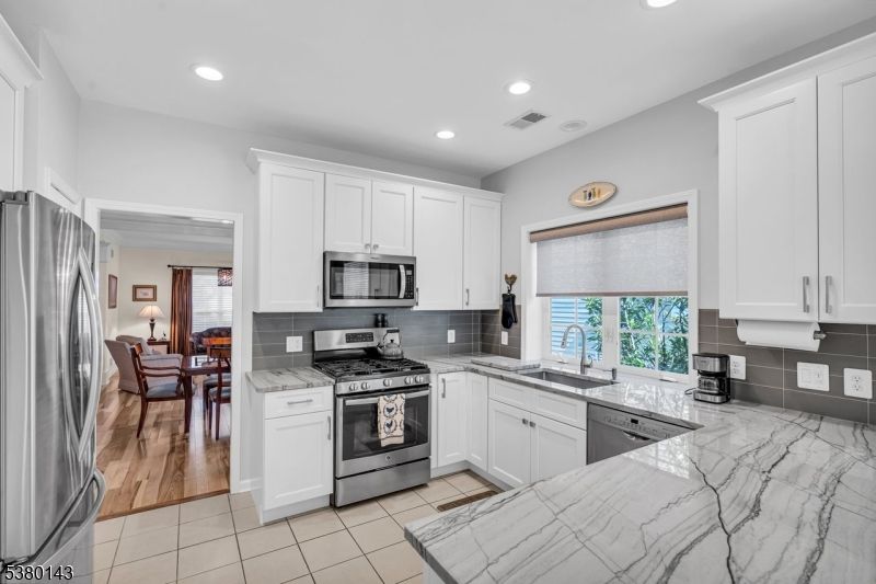 Dining room, Interior, Kitchen, Recessed Lighting, Stainless Steel Appliances, Wood Texture Flooring
