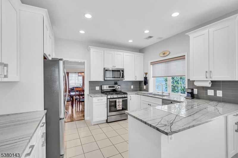 Dining room, Interior, Kitchen, Recessed Lighting, Stainless Steel Appliances, Wood Texture Flooring