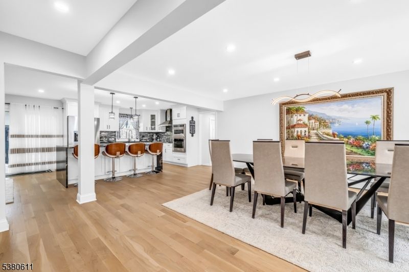 Dining room, Interior, Kitchen, Pendant Lights, Recessed Lighting, Stainless Steel Appliances, Water, Wood Texture Flooring