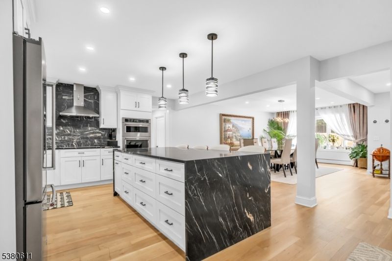 Dining room, Interior, Kitchen, Pendant Lights, Recessed Lighting, Stainless Steel Appliances, Wood Texture Flooring