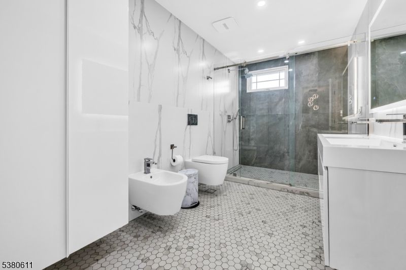 Bathroom, Dual Sink Vanities, Glass Shower, Interior, Marble Walls, Recessed Lighting