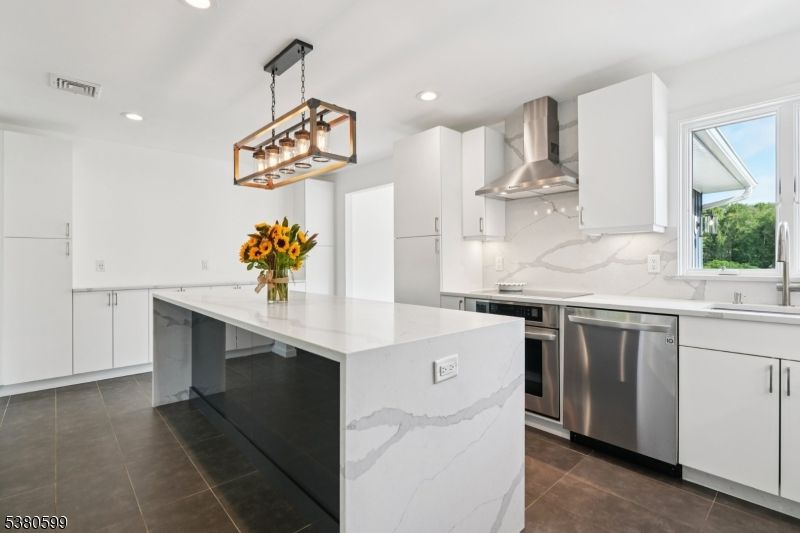 Interior, Kitchen, Marble Walls, Pendant Lights, Recessed Lighting, Stainless Steel Appliances