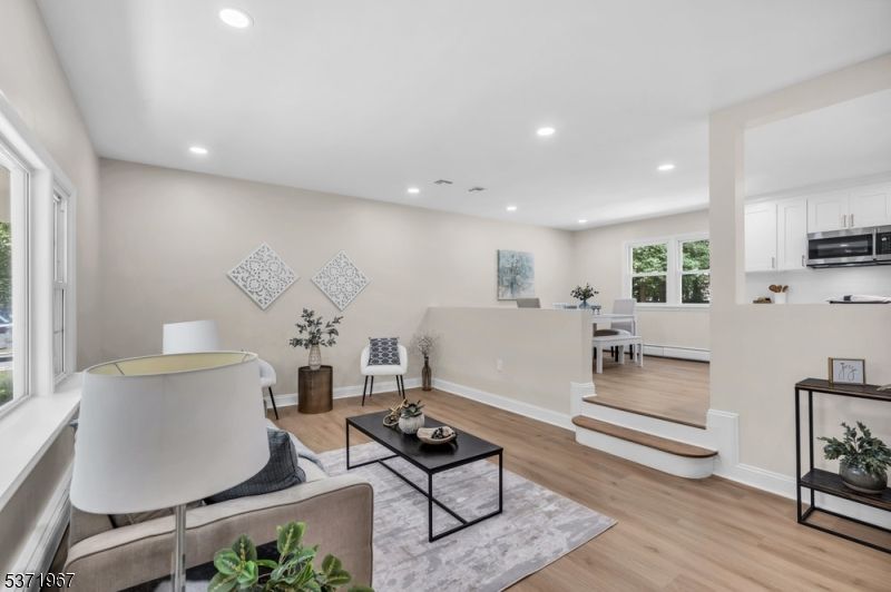 Dining room, Interior, Kitchen, Living room, Recessed Lighting, Stainless Steel Appliances, Wood Texture Flooring
