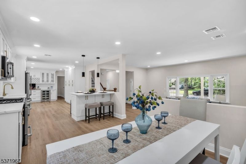 Dining room, Interior, Kitchen, Pendant Lights, Recessed Lighting, Stainless Steel Appliances, Wood Texture Flooring