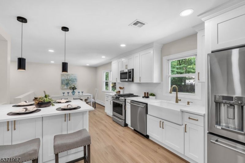 Dining room, Interior, Kitchen, Pendant Lights, Recessed Lighting, Stainless Steel Appliances, Wood Texture Flooring