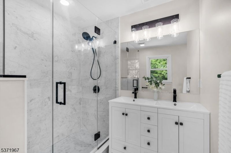 Bathroom, Dual Sink Vanities, Glass Shower, Interior, Marble Walls, Recessed Lighting