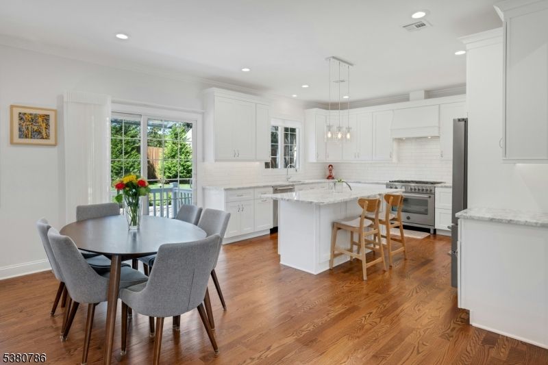 Dining room, Interior, Kitchen, Pendant Lights, Recessed Lighting, Stainless Steel Appliances, Wood Texture Flooring
