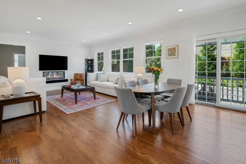 Dining room, Fireplace, Interior, Living room, Recessed Lighting, Wood Texture Flooring
