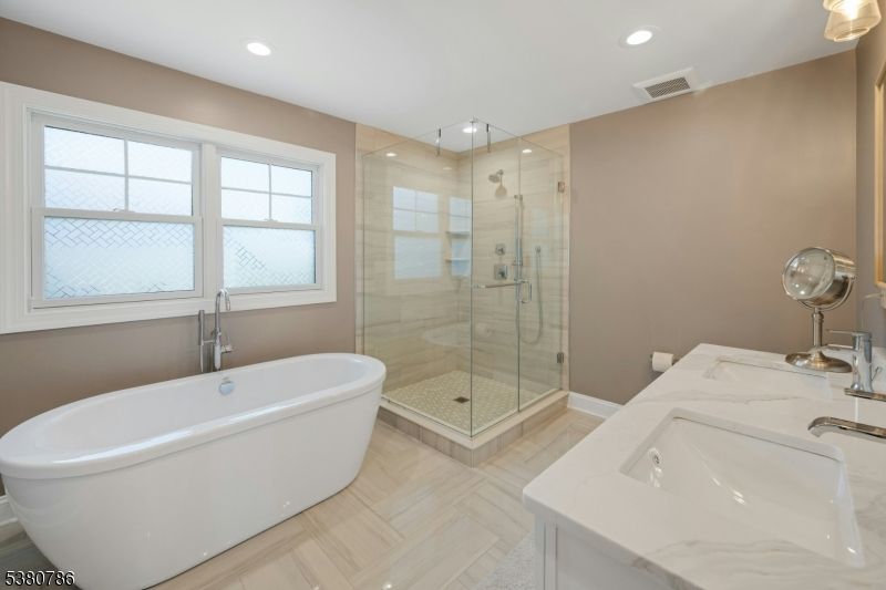 Bathroom, Dual Sink Vanities, Free Standing Baths, Glass Shower, Interior, Recessed Lighting, Wood Texture Flooring