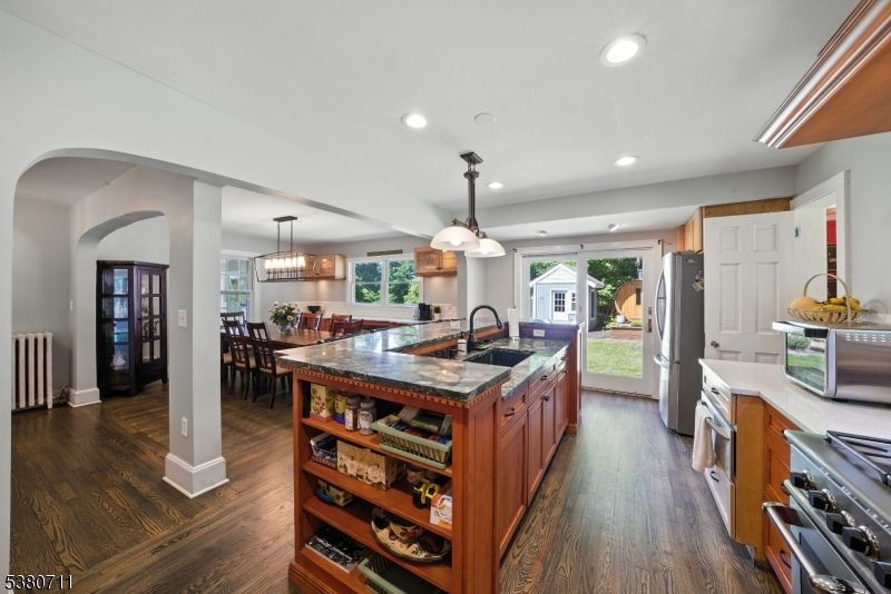 Chandelier, Dining room, Interior, Kitchen, Pendant Lights, Recessed Lighting, Stainless Steel Appliances, Wood Texture Flooring