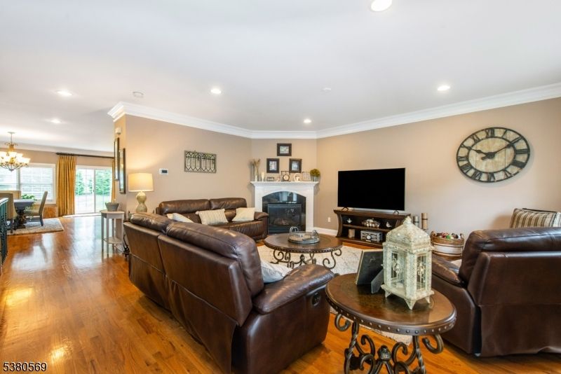 Chandelier, Dining room, Fireplace, Interior, Living room, Recessed Lighting, Wood Texture Flooring