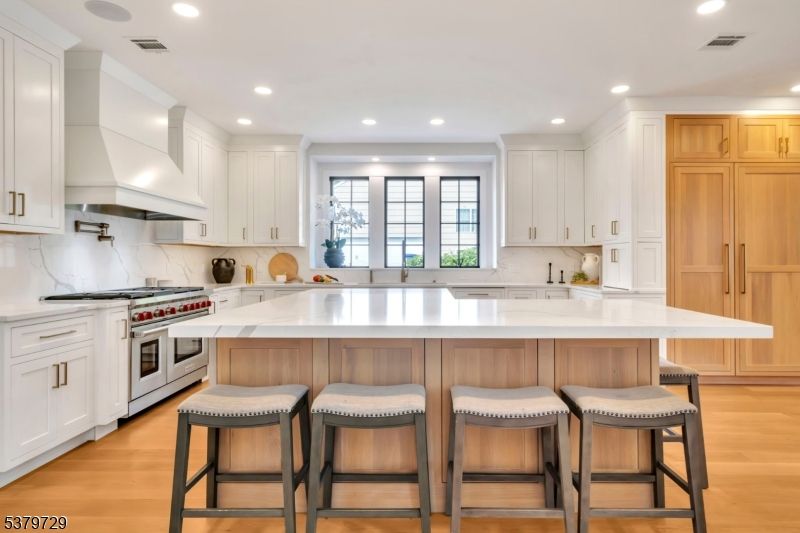 Interior, Kitchen, Marble Walls, Recessed Lighting, Stainless Steel Appliances, Wood Texture Flooring