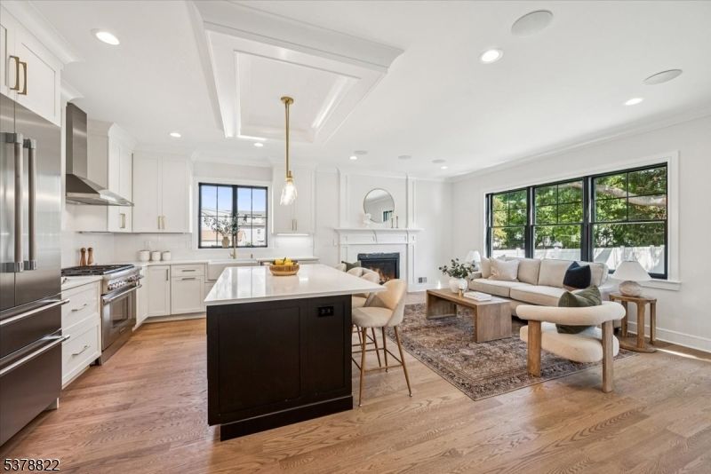 Fireplace, Interior, Kitchen, Living room, Pendant Lights, Recessed Lighting, Stainless Steel Appliances, Wood Texture Flooring