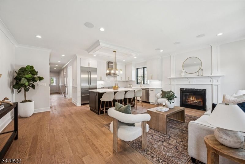 Fireplace, Interior, Kitchen, Living room, Pendant Lights, Recessed Lighting, Stainless Steel Appliances, Wood Texture Flooring