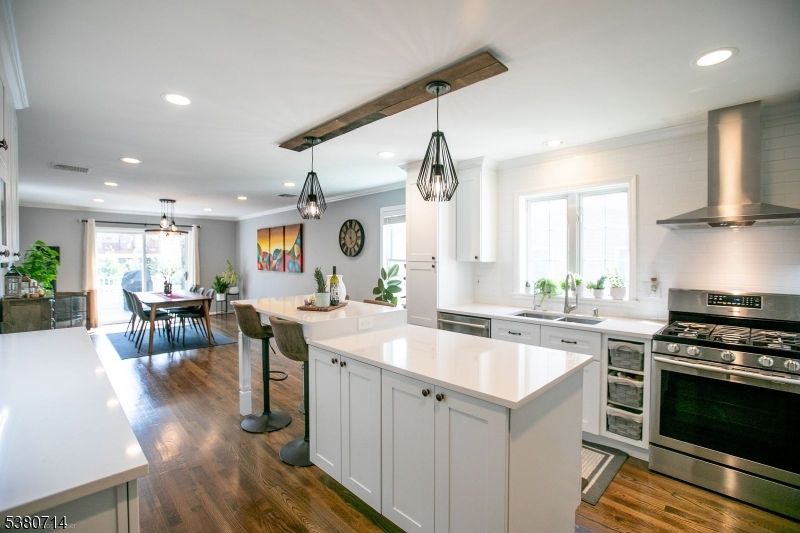 Dining room, Interior, Kitchen, Pendant Lights, Recessed Lighting, Stainless Steel Appliances, Wooden Beams, Wood Texture Flooring