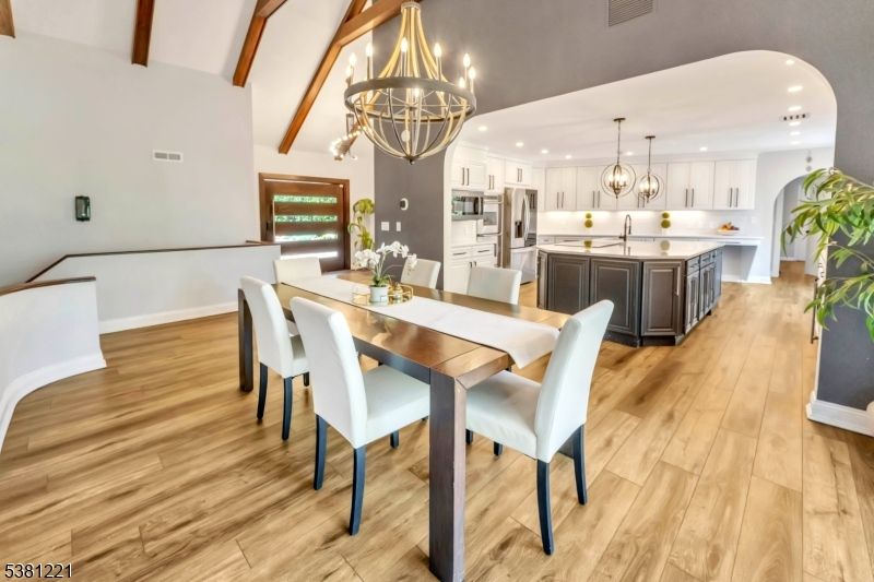 Chandelier, Dining room, Interior, Kitchen, Pendant Lights, Recessed Lighting, Stainless Steel Appliances, Wooden Beams, Wood Texture Flooring