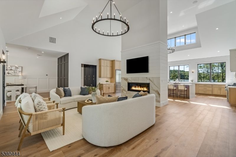 Chandelier, Fireplace, Interior, Living room, Pendant Lights, Recessed Lighting, Wood Texture Flooring