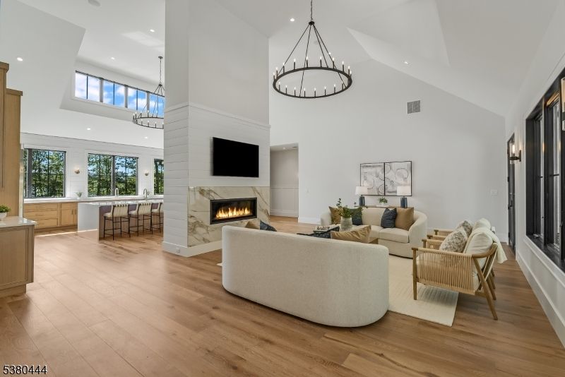 Chandelier, Fireplace, Interior, Living room, Pendant Lights, Recessed Lighting, Wood Texture Flooring