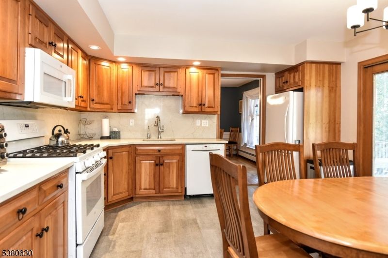 Dining room, Interior, Kitchen, Recessed Lighting, Stainless Steel Appliances, Wood Texture Flooring