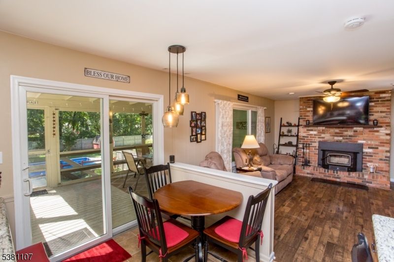 Dining room, Fireplace, Interior, Living room, Pendant Lights, Recessed Lighting, Stone Walls, Wood Texture Flooring