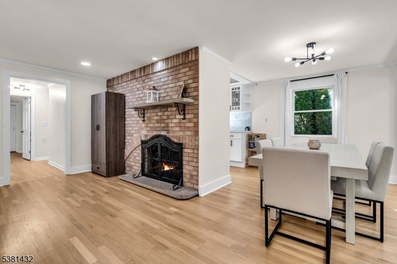 Dining room, Fireplace, Interior, Recessed Lighting, Stone Walls, Wood Texture Flooring
