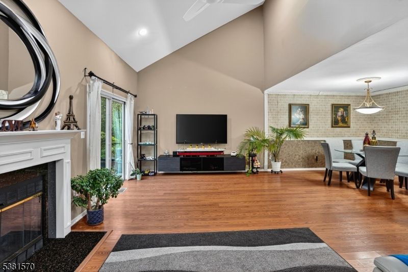 Dining room, Fireplace, Interior, Pendant Lights, Recessed Lighting, Stone Walls, Wood Texture Flooring