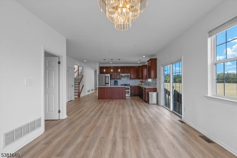 Chandelier, Interior, Kitchen, Pendant Lights, Recessed Lighting, Stainless Steel Appliances, Wood Texture Flooring